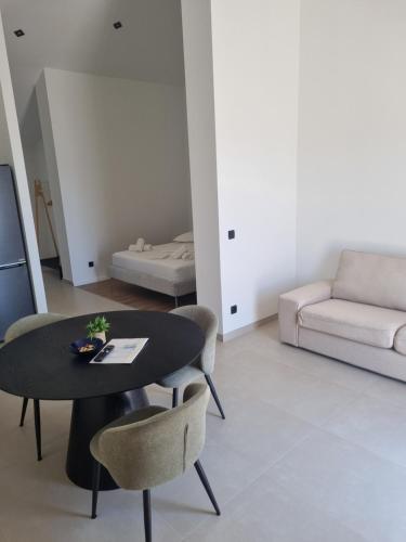 a living room with a table and chairs and a couch at Villa Mila in Bol