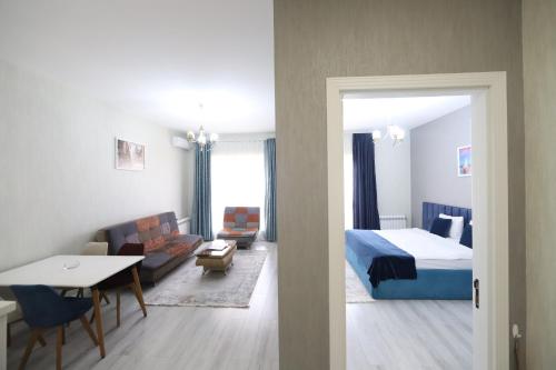 a hotel room with a bed and a table at Prime Boutique Hotel in Baku