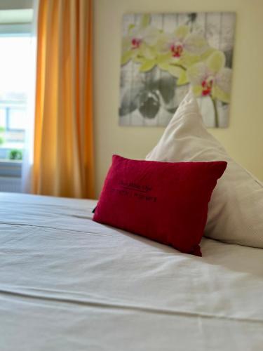 Ένα ή περισσότερα κρεβάτια σε δωμάτιο στο Hetzel's Hotel