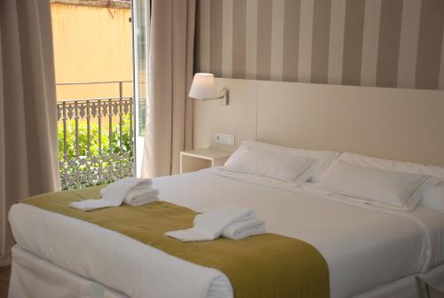 Postel nebo postele na pokoji v ubytování Hotel San Lorenzo Boutique