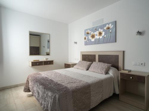 Ένα ή περισσότερα κρεβάτια σε δωμάτιο στο Apartamentos sol y playa