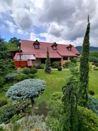 a house with a garden in front of it at Chalupa u Záhradníkov in Trebostovo