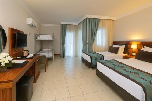 Ένα ή περισσότερα κρεβάτια σε δωμάτιο στο Xperia Grand Bali Hotel - All Inclusive