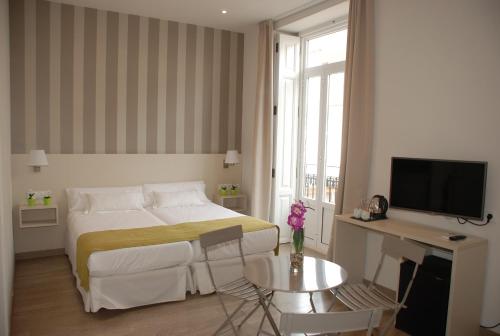 Postel nebo postele na pokoji v ubytování Hotel San Lorenzo Boutique