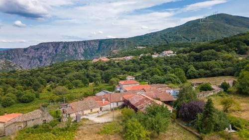 an aerial view of a village in the mountains at A Casa da Eira in Cerreda