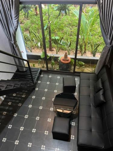 a view of a room with a table and chairs at Nguyen Shack Retreat Resort in Phong Nha