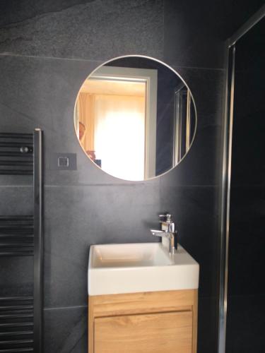 a bathroom with a sink and a mirror at Mari's double bedroom in Umag