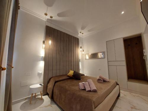 a bedroom with a bed with two towels on it at Alba Vera 5 Terre in La Spezia