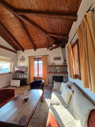 a living room with a couch and a table at Livadi Hideway Chalet by Ski Alure in Arachova