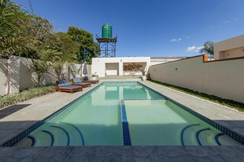 a swimming pool in the backyard of a house at Paris Royal Estate in Lusaka