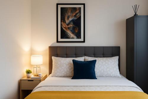 a bedroom with a bed and a picture on the wall at Furnished double room in Rowley Regis