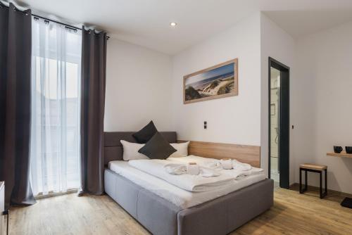 Ένα ή περισσότερα κρεβάτια σε δωμάτιο στο Hotel Montenegro