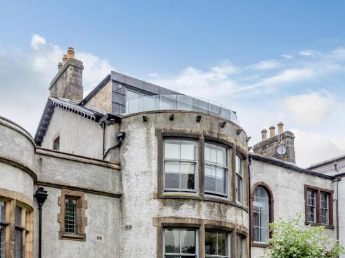 an old building with a glass dome on top of it at Cragdale Penthouse in Settle