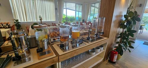 a counter with a bunch of different types of drinks at Pension Augustino in Ražanac