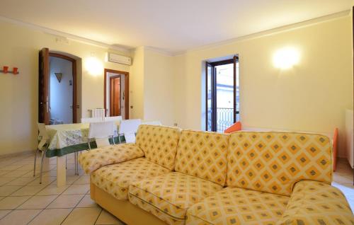 a living room with a couch and a table at Beautiful Apartment in Santa Maria di Castellabate