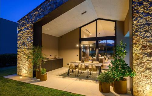 a dining area of a house with a table and chairs at Villa Silente in Bale