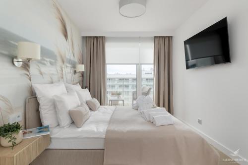 Ένα ή περισσότερα κρεβάτια σε δωμάτιο στο Baltini Premium Apartament Polanki Aqua