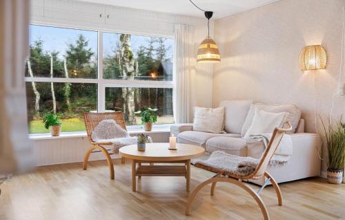 a living room with a couch and chairs and a table at Stunning Home In Sæby With Wifi in Sæby