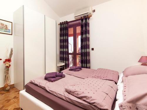 Postel nebo postele na pokoji v ubytování Apartments Cvek