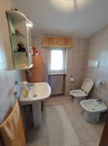 a bathroom with a sink and a toilet at Alba mare in Alba Adriatica