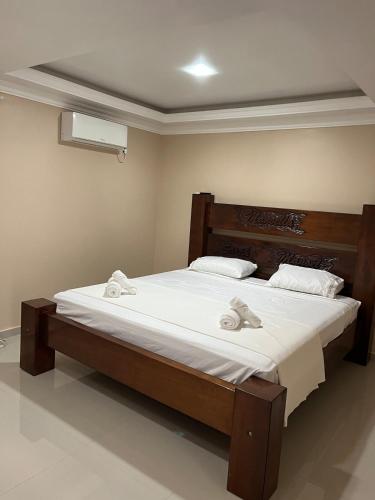 Katil atau katil-katil dalam bilik di Pousada da Luz 20v