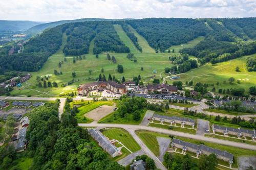 an aerial view of a village in the hills at Updated townhome - Walk to Holiday Valley in Ellicottville