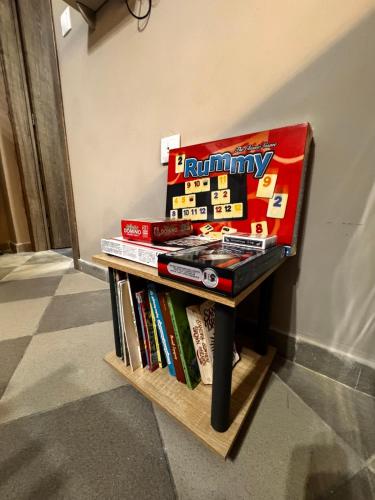 a pile of books sitting on a table next to a wall at PREVEZA DOWNTOWN garden in Preveza
