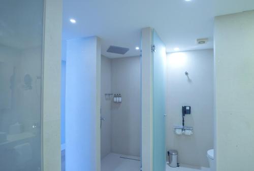 a bathroom with a shower with a glass door at Rixos Premium Dubrovnik in Dubrovnik