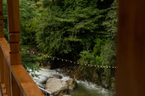 a view of a river with a string of lights at Tarzan Stays Jibhi in Shoja