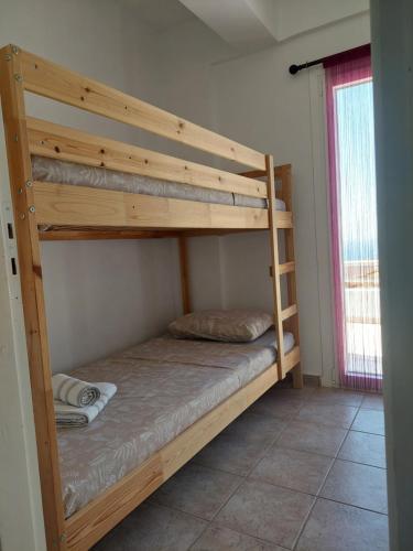 Ένα ή περισσότερα κρεβάτια σε δωμάτιο στο Socrates House Kythnos