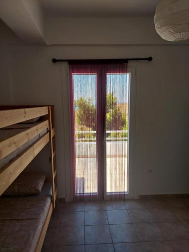 Ένα ή περισσότερα κρεβάτια σε δωμάτιο στο Socrates House Kythnos
