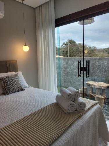 Ένα ή περισσότερα κρεβάτια σε δωμάτιο στο Cipó Lofts - Serra do Cipó