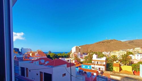 a view of a city with buildings and a mountain at Miramar 5 - San Sebastin de La Gomera in San Sebastián de la Gomera