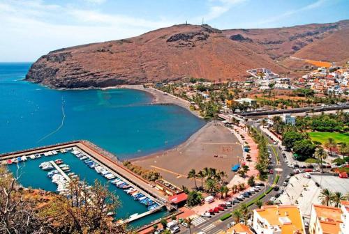 an aerial view of a town with a beach and a mountain at Miramar 5 - San Sebastin de La Gomera in San Sebastián de la Gomera