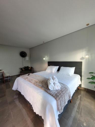 Ένα ή περισσότερα κρεβάτια σε δωμάτιο στο Cipó Lofts - Serra do Cipó