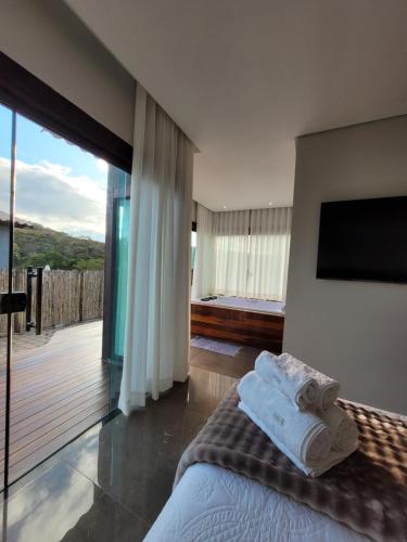 Ένα ή περισσότερα κρεβάτια σε δωμάτιο στο Cipó Lofts - Serra do Cipó