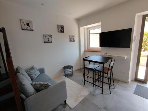 a living room with a couch and a table at Affittacamere il Ciliegio in Trieste