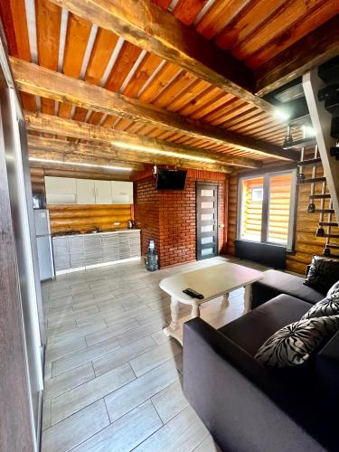 a living room with a couch and a table at Гостевой дом Фестивальный in Kyiv
