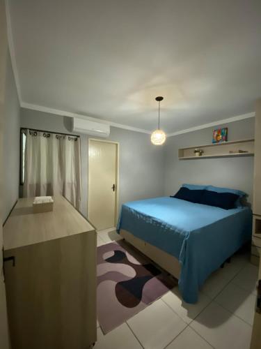 Ένα ή περισσότερα κρεβάτια σε δωμάτιο στο Apartamento familiar há 5min do centro