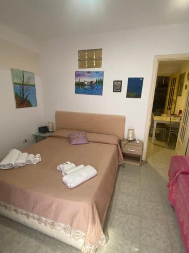 Posteľ alebo postele v izbe v ubytovaní Casa vacanza La Ninfea intera casa