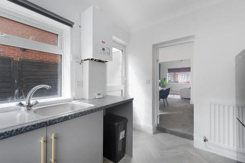 a kitchen with a sink and a window at Your Home Away in Bishop Auckland