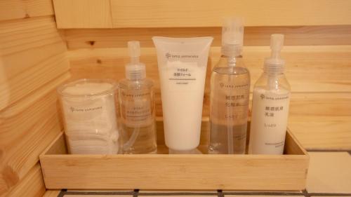 a wooden drawer with bottles and containers in it at lamp yamanaka-山中湖 河口湖 プライベートヴィラ-132平米-最大10名-BBQ無料-乳幼児可-長期滞在設備充実-山中湖車5分-河口湖車20分 in Yamanakako