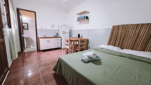 a bedroom with a bed with a stuffed animal on it at Andino Temporarios in Salta