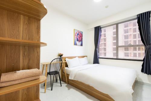 Ένα ή περισσότερα κρεβάτια σε δωμάτιο στο The best price apartment at SOHO