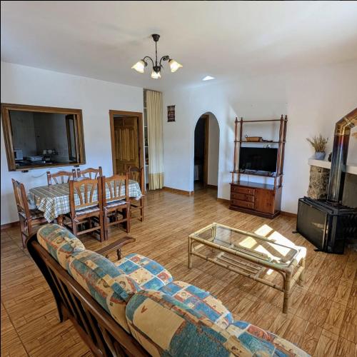 a living room with a couch and a table at Casa Rural La Granja in Letur