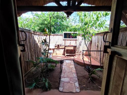 a view of a patio from the inside of a house at Leopard Rest Camp in Mbarara