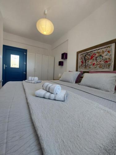 Ένα ή περισσότερα κρεβάτια σε δωμάτιο στο Socrates House Kythnos