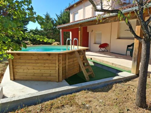 a pool in a yard with a house at La Fontaine in Montgaillard-Lauragais