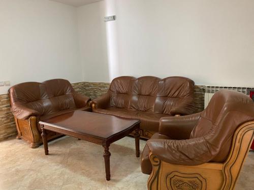 a living room with couches and a coffee table at Villa Rezevici in Katun