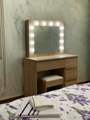 a dressing table with a mirror and a bed at Villa Rezevici in Katun
